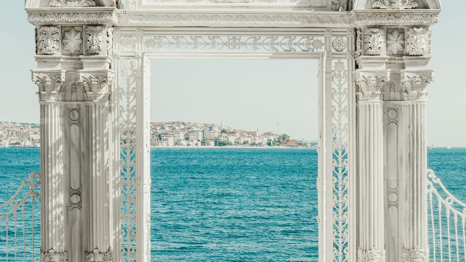 Ornate Dolmabahçe Palace gate opening onto the Bosphorus in Istanbul