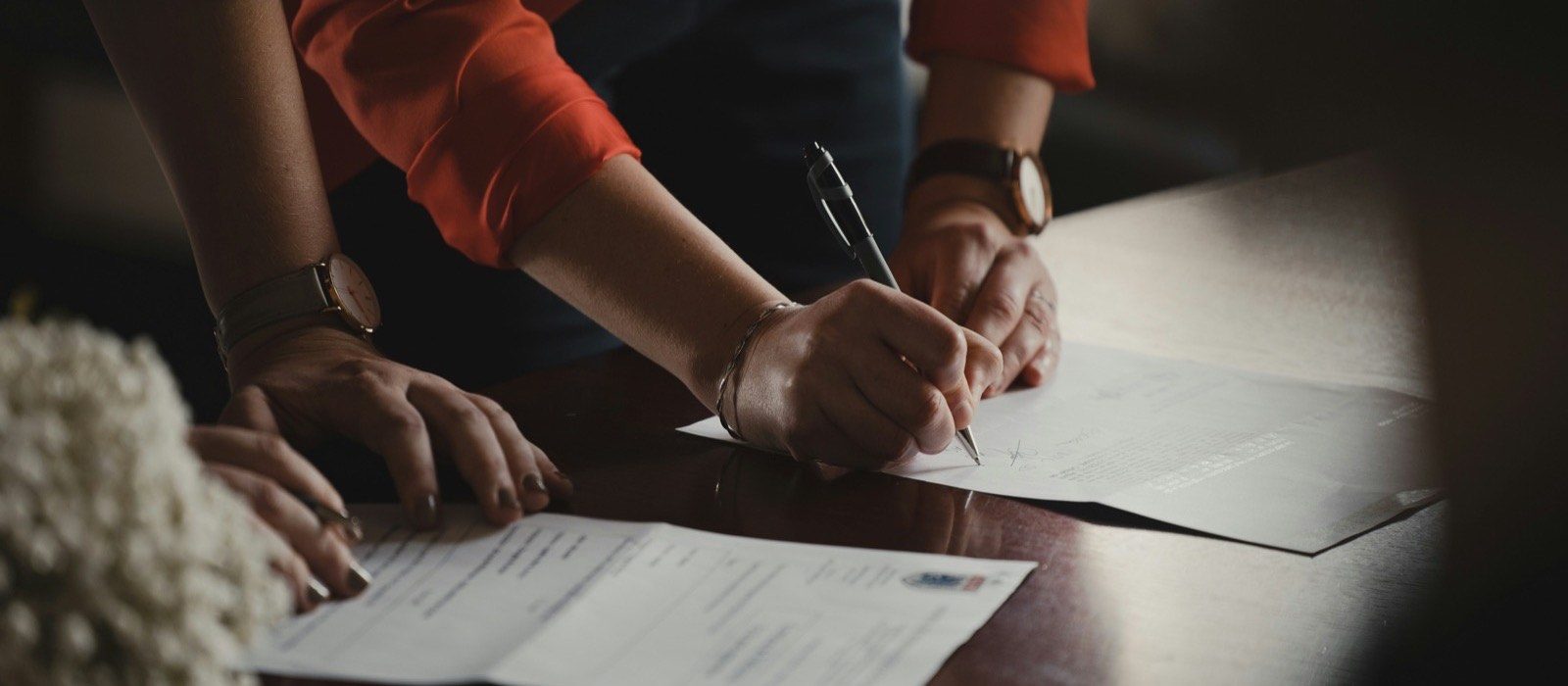 Person signing a legal document